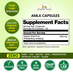Organic Veda Amla Fruit Capsules in a clear container, showing small, round capsule pills on a plain background.