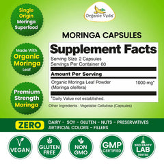 Organic Veda Moringa Capsules showing a bottle of green herbal capsules on a white background.