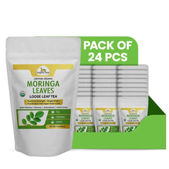 Organic Veda Moringa loose leaf tea powder with dried green moringa leaves in a 7oz pack, shown in a natural, close-up image.