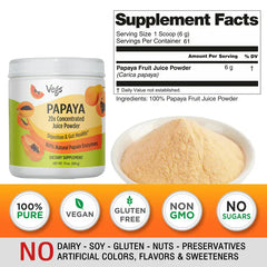 Vegs papaya juice powder in a clear jar, showing vibrant orange powdered fruit product with a scoop beside it.